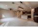 Open-concept living area with carpet, adjacent to a modern kitchen with stainless appliances at 6853 E Posada Cir, Mesa, AZ 85212