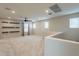 Bright loft with neutral carpet, a ceiling fan, recessed lights, and decorative shelving at 6853 E Posada Cir, Mesa, AZ 85212