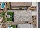 Aerial view features backyard with a green lawn and shaded patio at 730 W Wind Cave Dr, San Tan Valley, AZ 85140