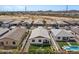 Aerial view of home showcasing the backyard patio and landscaping at 730 W Wind Cave Dr, San Tan Valley, AZ 85140
