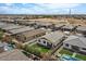 Aerial view of home's backyard with pool and lush landscaping at 730 W Wind Cave Dr, San Tan Valley, AZ 85140