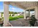 Outdoor patio featuring string lights, a grill, and a manicured lawn with landscaping at 730 W Wind Cave Dr, San Tan Valley, AZ 85140