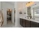 Bathroom featuring a double vanity, modern fixtures, and access to walk in closet at 730 W Wind Cave Dr, San Tan Valley, AZ 85140