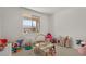 Playful bedroom with a large window, an assortment of toys, and ample natural light at 730 W Wind Cave Dr, San Tan Valley, AZ 85140