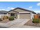 Charming single-story home featuring a two-car garage, well-maintained landscaping, and a welcoming facade at 730 W Wind Cave Dr, San Tan Valley, AZ 85140