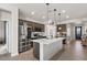 Bright kitchen showcasing stainless steel appliances and white countertops with stylish lighting at 730 W Wind Cave Dr, San Tan Valley, AZ 85140