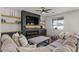 Spacious living room with built-in entertainment center and ample natural light at 730 W Wind Cave Dr, San Tan Valley, AZ 85140