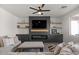 Cozy living room with modern fireplace, floating shelves, and neutral decor at 730 W Wind Cave Dr, San Tan Valley, AZ 85140