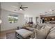 Comfortable living room adjacent to kitchen offers plenty of seating and natural light at 730 W Wind Cave Dr, San Tan Valley, AZ 85140
