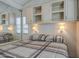 Bedroom featuring coordinated cabinets above a bed with natural lighting from the window at 7750 E Broadway Rd # 294, Mesa, AZ 85208