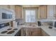Efficient kitchen features white appliances, bright countertops, and great natural light at 7750 E Broadway Rd # 294, Mesa, AZ 85208