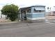 Charming single-story home with covered porch and blue and white trim at 7807 E Main St # D-6, Mesa, AZ 85207