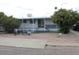 Charming single-story home with a covered porch and well-maintained landscaping at 7807 E Main St # D-6, Mesa, AZ 85207