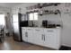 Cozy kitchen features stainless steel appliances, white cabinets, and floating shelves at 7807 E Main St # D-6, Mesa, AZ 85207