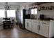Modern kitchen with stainless steel appliances, white cabinets, and adjacent dining area at 7807 E Main St # D-6, Mesa, AZ 85207