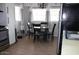 Eat-in kitchen with dining area, stainless appliances, and cozy lighting at 7807 E Main St # D-6, Mesa, AZ 85207