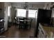 Kitchen view showing stainless steel refrigerator, sink and dining area at 7807 E Main St # D-6, Mesa, AZ 85207