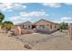 Backyard with desert landscaping, a BBQ, pizza oven, and string lights at 8004 W Robin Ln, Peoria, AZ 85383