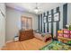 Fun bedroom with playful decorations, gray and blue accent wall, and wood-style flooring at 8004 W Robin Ln, Peoria, AZ 85383