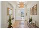 Elegant foyer featuring tile floors, modern lighting, and decorative accents at 8004 W Robin Ln, Peoria, AZ 85383