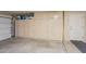 Spacious garage with built-in storage cabinets along the back wall for organization at 8004 W Robin Ln, Peoria, AZ 85383