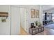Bright hallway featuring tile floors, decorative accents, and a glimpse into the dining area at 8004 W Robin Ln, Peoria, AZ 85383
