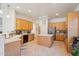 Spacious kitchen features an island, stainless appliances, light wood cabinets, and tile flooring at 8004 W Robin Ln, Peoria, AZ 85383
