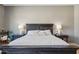 Charming main bedroom with rustic furnishings and decorative bedside lamps at 8004 W Robin Ln, Peoria, AZ 85383