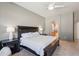 Spacious main bedroom with elegant rustic furniture and adjoining bathroom entrance at 8004 W Robin Ln, Peoria, AZ 85383