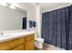 This is a view of a bathroom with a unique patterned shower curtain at 8325 N 61St Ln, Glendale, AZ 85302
