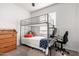 This bedroom features a bunk bed, desk, and dresser, perfect for a room or guest space at 8325 N 61St Ln, Glendale, AZ 85302