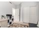 Bedroom with a sleek grey wall and a cozy rug at 8325 N 61St Ln, Glendale, AZ 85302