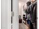 Walk-in closet with organized shelves, hanging racks, and ample storage space for clothing and accessories at 8325 N 61St Ln, Glendale, AZ 85302