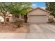 Charming single-story home with a two-car garage and low maintenance front yard at 8325 N 61St Ln, Glendale, AZ 85302
