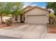 Charming single-story home with a two-car garage and low maintenance front yard at 8325 N 61St Ln, Glendale, AZ 85302