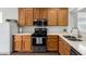 Well-lit kitchen featuring sleek stainless steel appliances and classic cabinetry at 8325 N 61St Ln, Glendale, AZ 85302