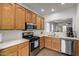 Spacious kitchen boasts stainless steel appliances, stylish countertops, and light wood cabinetry at 8325 N 61St Ln, Glendale, AZ 85302