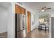 Bright kitchen area with stainless steel appliances, breakfast nook and tile flooring at 8325 N 61St Ln, Glendale, AZ 85302