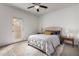 Relaxing bedroom with neutral tones, ceiling fan, and door to the backyard at 8325 N 61St Ln, Glendale, AZ 85302
