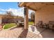Relaxing covered patio with ample seating, string lights, and outdoor dining area, perfect for entertaining at 8325 N 61St Ln, Glendale, AZ 85302