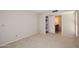 Bedroom with neutral walls, carpet flooring, and an en-suite bathroom at 8625 E Belleview Pl # 1012, Scottsdale, AZ 85257
