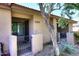 Inviting condo entrance features secure gate, desert landscaping, and clear unit number for easy identification at 8625 E Belleview Pl # 1012, Scottsdale, AZ 85257