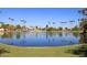 Scenic lake view in the community, dotted with palm trees and offering a serene environment at 8625 E Belleview Pl # 1012, Scottsdale, AZ 85257