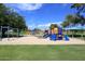 Community playground with colorful equipment on a soft sand base at 8625 E Belleview Pl # 1012, Scottsdale, AZ 85257