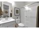 Modern bathroom featuring a sleek vanity, toilet, and glass-enclosed shower for a clean and stylish look at 9734 E Spiral Ave, Mesa, AZ 85212