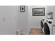 Bright laundry room with modern washer and dryer units, offering convenience and functionality at 9734 E Spiral Ave, Mesa, AZ 85212