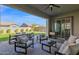 Outdoor patio featuring comfortable seating, dining area, and scenic backyard views, ideal for gatherings at 9734 E Spiral Ave, Mesa, AZ 85212
