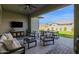 Inviting outdoor patio with comfortable seating, perfect for relaxing and entertaining in style at 9734 E Spiral Ave, Mesa, AZ 85212
