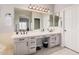Bathroom featuring a large vanity with double sinks, plenty of counter space at 9758 E Monterey Ave, Mesa, AZ 85209