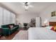 Bedroom with hardwood floors, a ceiling fan, and bright, natural light at 9758 E Monterey Ave, Mesa, AZ 85209